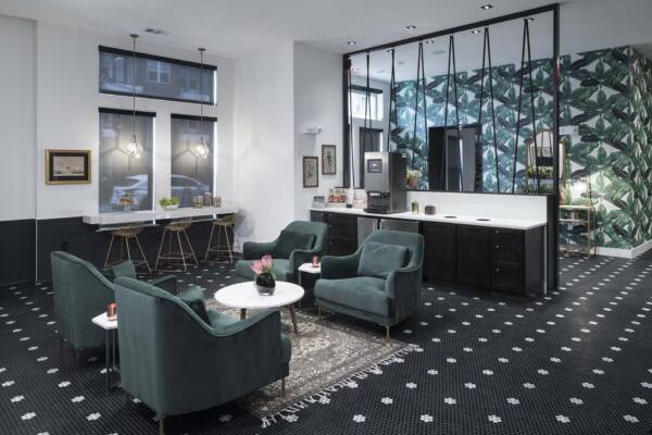Griffis Oak Lawn apartment community leasing lounge with coffee machine in Dallas, TX.