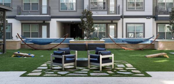 Griffis Oak Lawn apartment community outdoor lounge with hammocks in Dallas, TX.