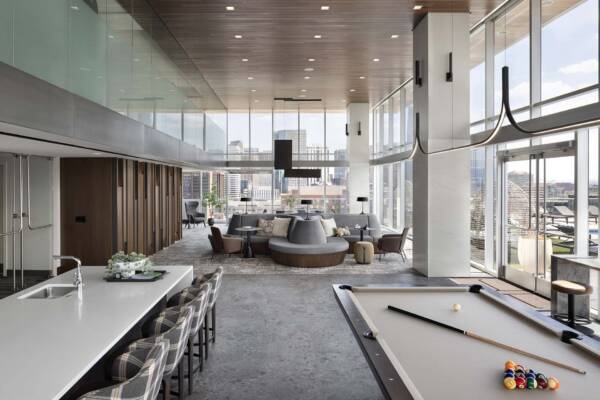Apartment community resident lounge with pool table at Griffis Platform Union Station in Denver, CO