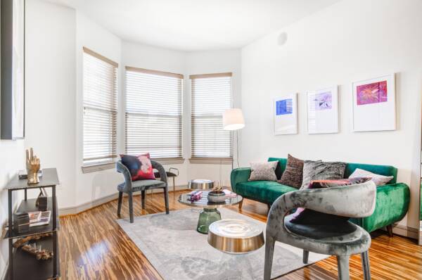 Griffis Uptown apartment living room with wood style flooring.